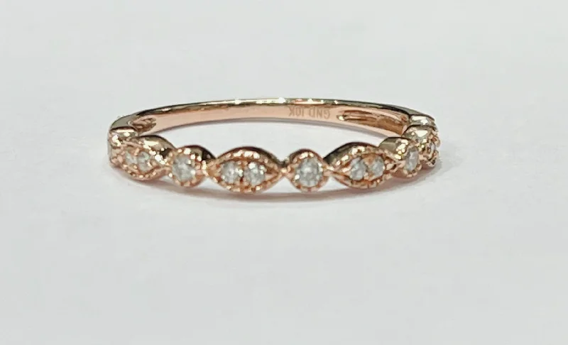 Women’s silver stackable rings-This fun and fashionable ring is a 10k rose gold diamond rin...