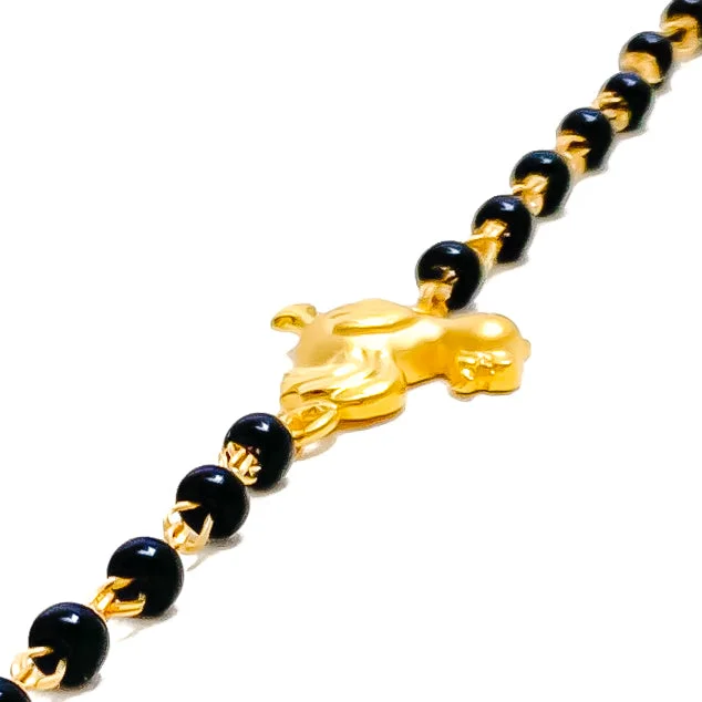 Women’s ethnic bangles-Radiant Sleek 22k Gold Black Bead Baby Bracelet