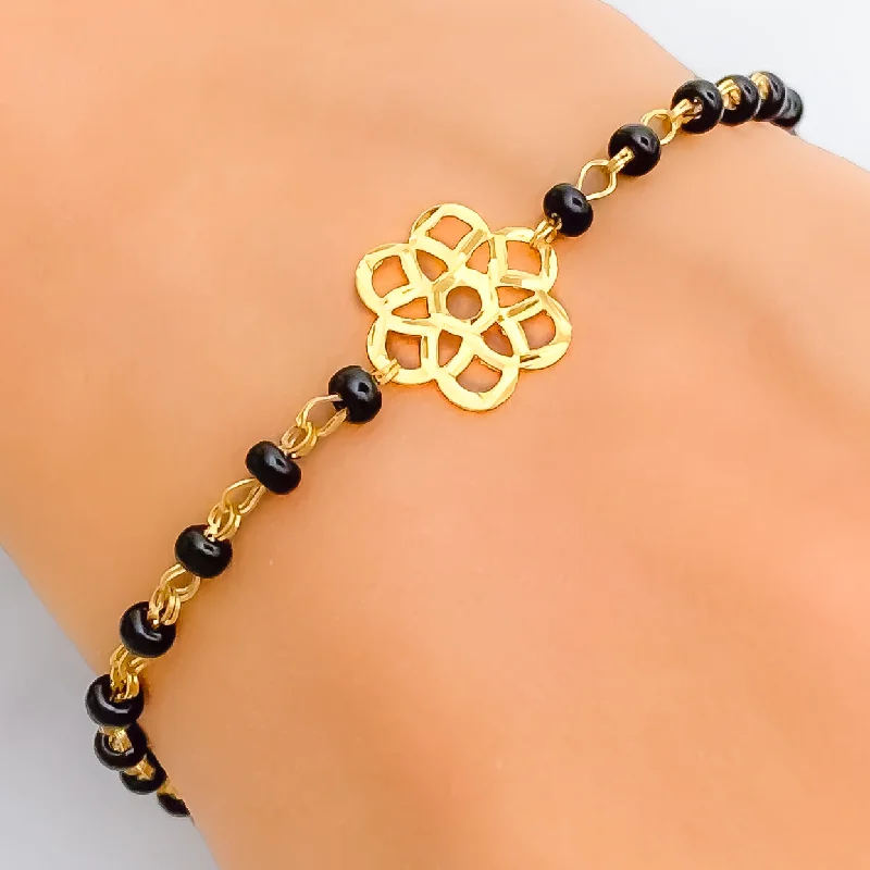 Women’s designer bangles-Subtle Flower 22k Gold Black Bead Bracelet