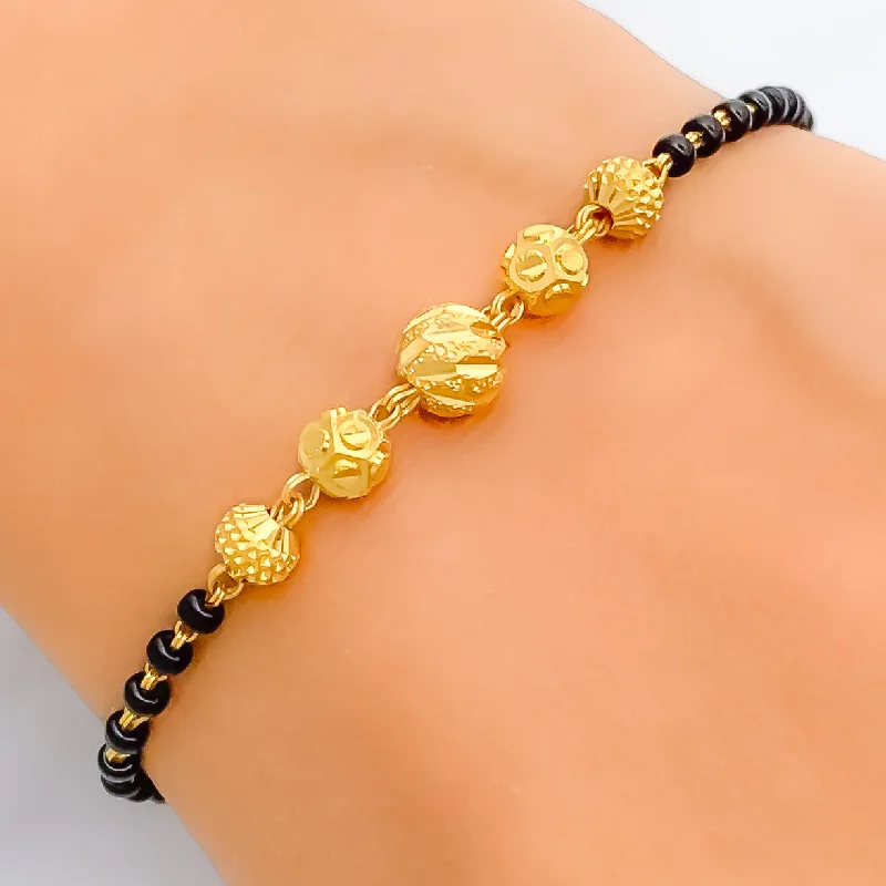 Women’s custom engraved bracelets-Elevated Fashionable 22k Gold Black Bead Bracelet