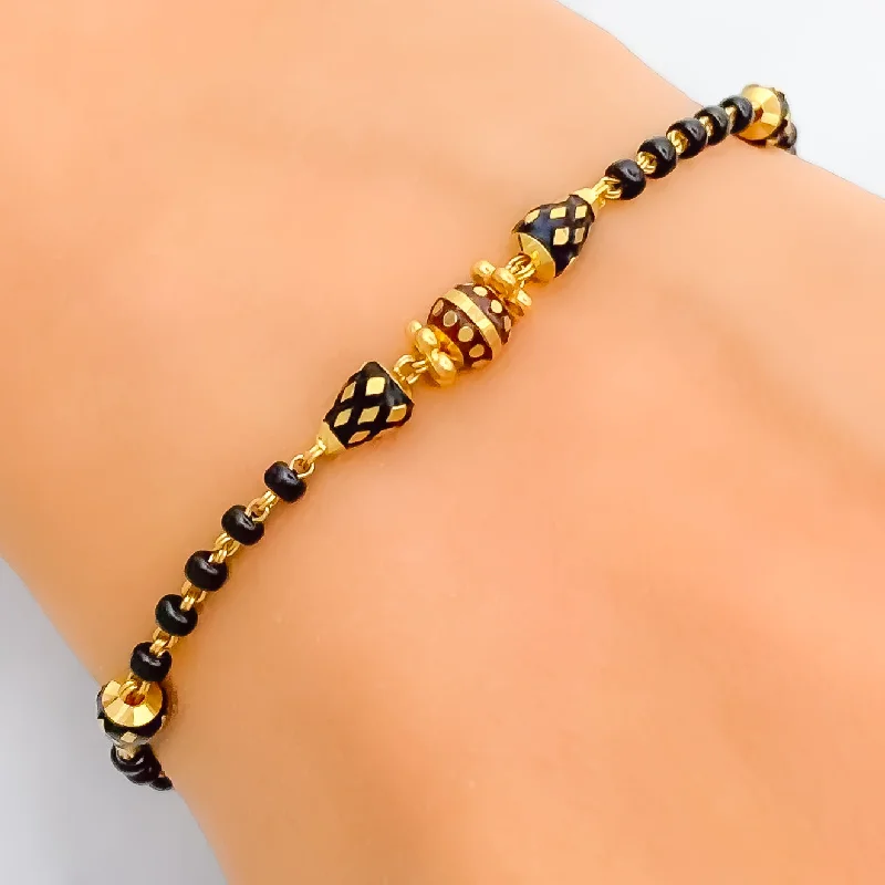 Women’s diamond cuff bracelets-Luminous Lightweight 22k Gold Black Bead Bracelet